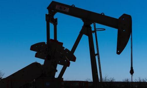 A silhouette of an oil pumpjack.